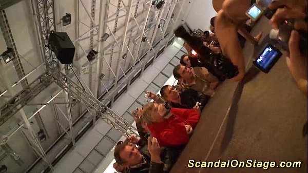 buxomy stunner handballing on public stage