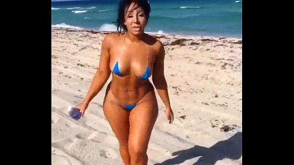 Sexy Latina in mini swimsuit on the beach