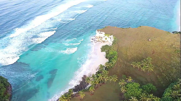 Asian beauty, Putri Cinta uncovering her suntanned vag on a tropical beach