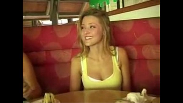 Nubile displaying her tits in public place