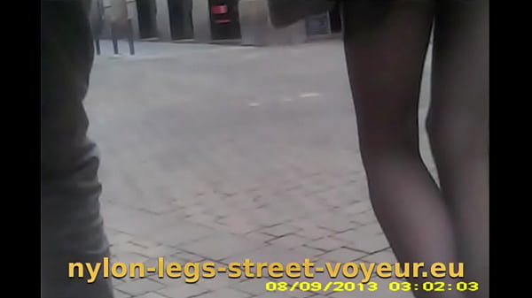 Nice gams on the street brief with black pantyhoses