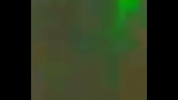 Green silky sundress walk at street