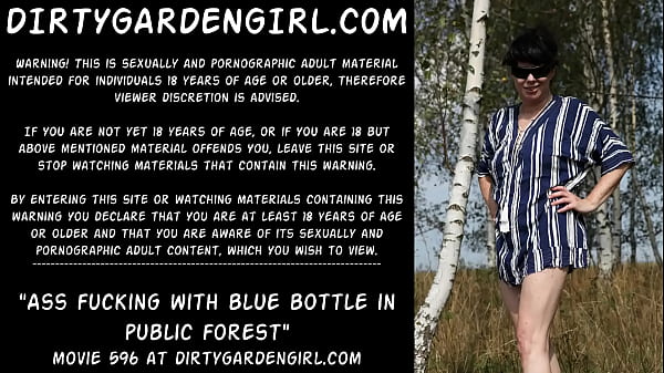 Butt fucking with blue bottle in public forest