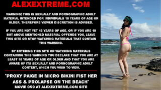Proxy Paige in micro swimsuit knuckle her arse & rosebud on the beach